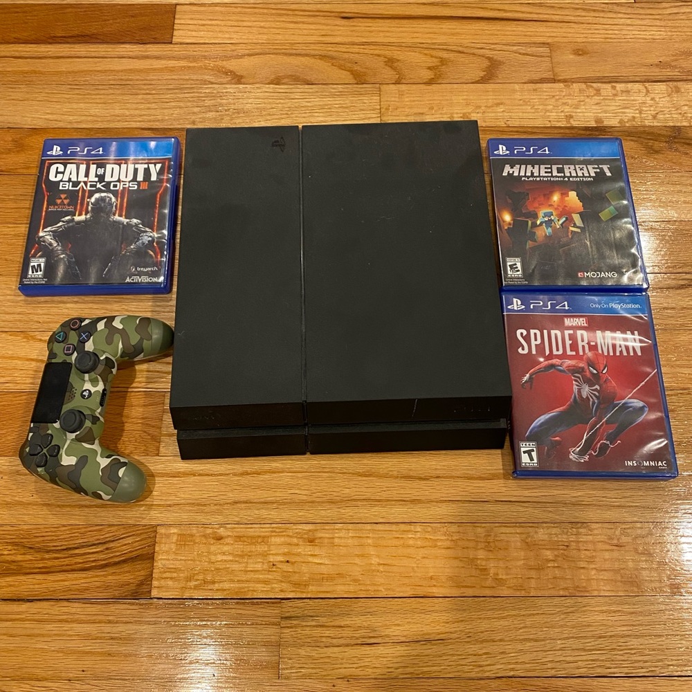 PS4 console with controller and games